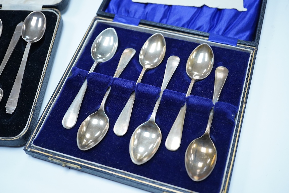 A cased set of six George VI Art Deco silver teaspoons and pair of sugar tongs, by C.W. Fletcher & Son Ltd, Sheffield, 1936, together with a cased set of six silver bean end coffee spoons and a cased set of six plated te